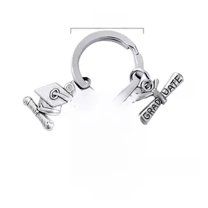 Polished stainless steel 2026 graduation keychain with heart charm and mortarboard cap