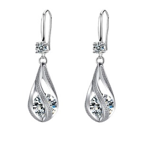 Detail of silver drop earrings with large round zircon and sparkling pavé accents