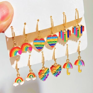 Detail of 6-pair rainbow earring set featuring heart shapes and Love Wins text