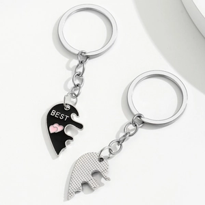 Best Friends split heart puzzle keychain with black enamel and pink heart detail