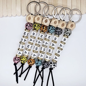 Handmade leopard wood bead keychain set with MOA letters and eye engraving charms