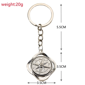 Detail view of rotating silver compass keychain showing dimensions 3.5cm and 20g weight