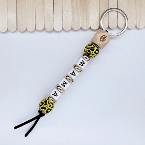 Detail of MAMA letter beads leopard print wooden beads and black tassel keychain