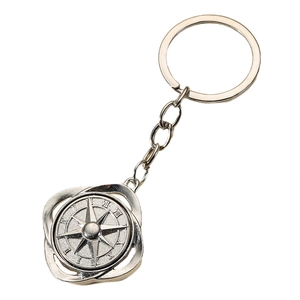 Spinning silver alloy compass keychain with nautical star and Roman numerals design