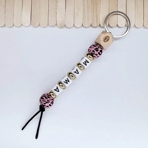 Detail of leopard print silicone beads and engraved wood bead keychain for Mother's Day gift