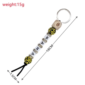 Detail of beaded keychain with leopard print beads and MAMA wood lettering charm