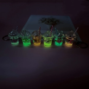 Glow-in-the-dark mini fruit tea cup keychain set with neon liquid and colorful straws