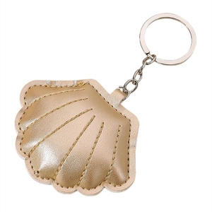 Golden PU leather shell keychain with decorative stitching and silver metal ring