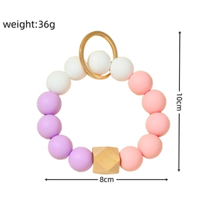 Porte-clés bracelet en perles de silicone et bois avec anneau doré pour sacs
