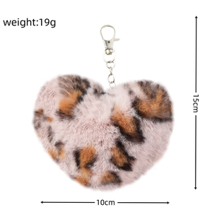Detailed plush heart keychain in pink leopard print pattern with size measurements