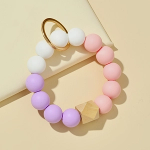Porte-clés bracelet en perles de silicone et bois avec perles roses et dorées