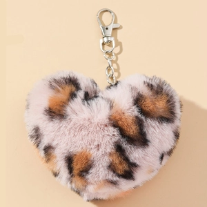 Detailed close-up of a leopard print plush heart keychain with silver metal clip