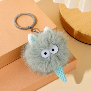 Detailed macro view of a cute cartoon plush monster ice cream keychain with fuzzy texture