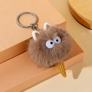 Detailed view of plush ice cream cat keychain with soft brown fur and metallic ring