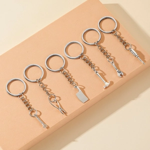 Detailed macro view of 6-piece silver metal tool keychain set on display stand
