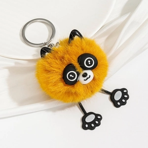 Detailed view of fluffy orange plush animal keychain with soft fur and silver keyring
