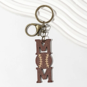Detail of wooden MOM keychain with baseball design and bronze metal lobster clasp