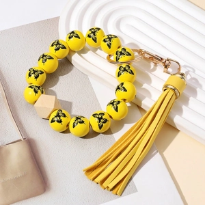 Porte-clés bracelet en perles jaunes avec papillons, perle en bois et gland en cuir