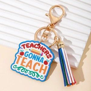 Rainbow teacher keychain with colorful tassel and gold lobster clasp on white background
