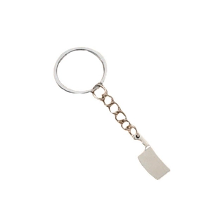 Miniature chef knife keychain made of silver alloy metal on white background