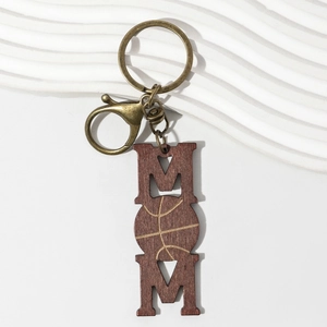 Detail of wooden MOM keychain with basketball texture and antique bronze lobster clasp