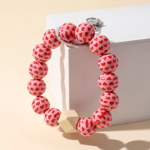 Pink heart print wooden bead keychain bracelet with silver metal ring and geometric wood bead