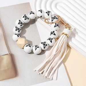 Bracelet porte-clés bohème en perles de bois avec papillon et long gland blanc
