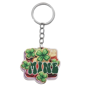 Macro view of St. Patrick's Day keychain with green clover design and Mine text