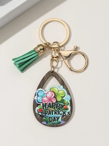 Detail showing St. Patrick's Day wooden pendant with clover and green tassel charm