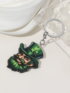 Detail of St. Patrick's Day leprechaun keychain with green shamrock on a silk background
