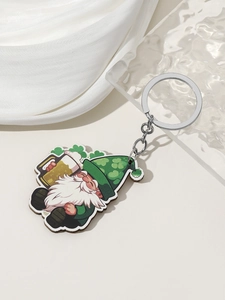 Close-up of a St. Patrick's Day gnome keychain with a beer mug on a silk background