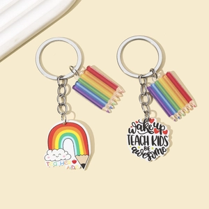 Acrylic rainbow pencil teacher keychains with Teacher Aide and inspirational slogan