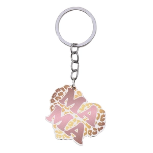 Close-up of heart-shaped MAMA keychain featuring leopard print and pink lettering