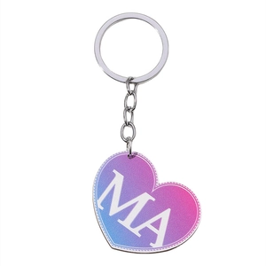 Detail view of heart-shaped keychain with purple gradient texture and white MA lettering