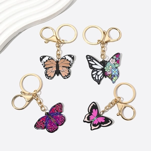 Detailed set of four acrylic butterfly keychains with gold metal rings and lobster clasps