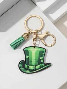 Detail of St. Patrick's Day keychain with green hat, clover pattern, and matching tassel