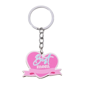 Detail of pink heart-shaped keychain with Best Mom text and blue ribbon accents