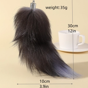 Faux fox tail keychain size guide showing 30cm length on a warm beige background