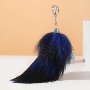 Faux fur fox tail keychain in blue and black plush with silver spring clip for bags