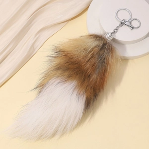 Faux fox tail keychain in brown and white gradient plush with silver metal clasp