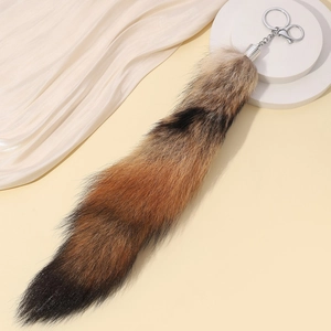 Faux fur fox tail keychain with brown and black gradient plush fur and silver lobster clasp