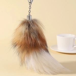 Faux fox tail keychain in brown and white gradient plush with silver metal clasp