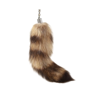 Faux fur fox tail keychain with brown and tan stripes and silver metal clasp