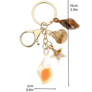 Portachiavi tema oceano con conchiglia luminosa, stella marina e anello d'oro per borse