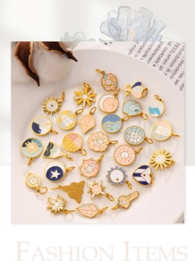 Detailed collection of assorted enamel sun, moon, and star charms in gold metal frames