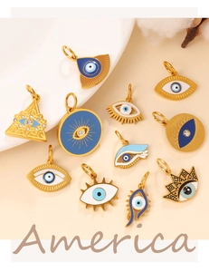 Detailed view of various golden Hamsa Hand and Evil Eye charms with blue enamel inlay
