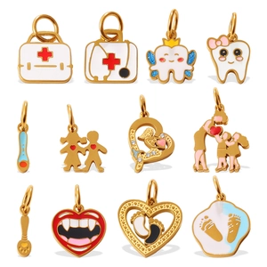 Golden enamel medical charms set featuring first aid kit and heart stethoscope designs