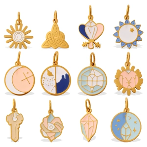 Set of 12 celestial enamel charms featuring sun, moon, and star designs for DIY jewelry