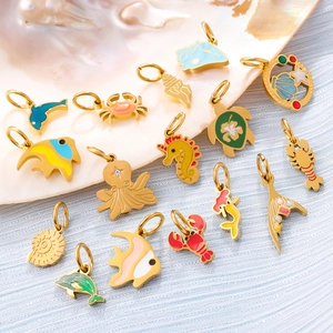 Golden ocean theme jewelry pendants with colorful enamel sea creatures on shell