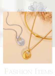 Macro shot of layered gold and silver geometric necklaces with stylish snake chain detail